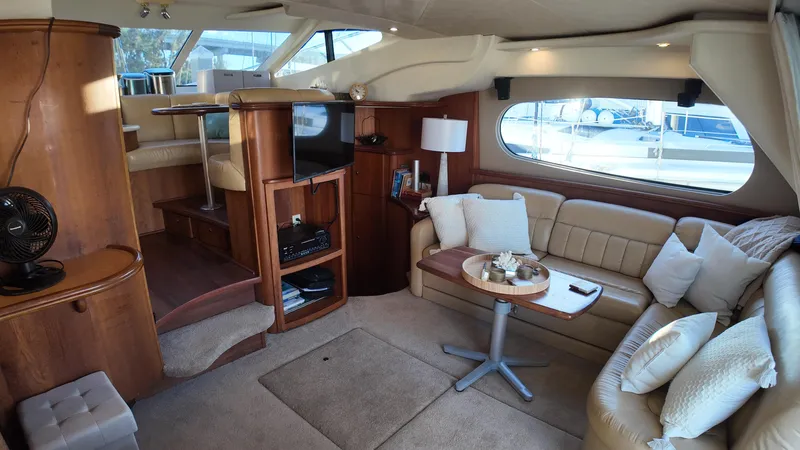  Yacht Photos Pics Luxurious interior of a 2002 Silverton 410 Sport Bridge yacht with plush seating and modern amenities.