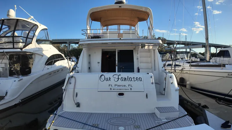  Yacht Photos Pics 2002 Silverton 410 Sport Bridge yacht docked at marina, named "Our Fantasea."