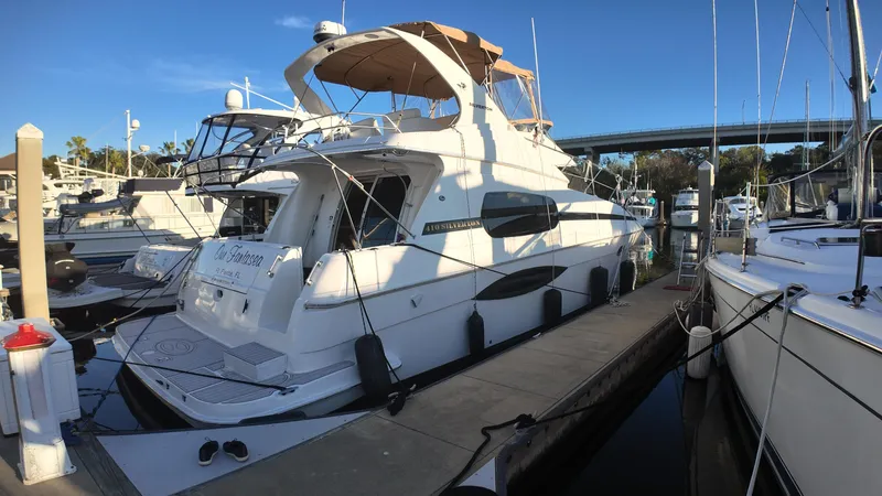  Yacht Photos Pics 2002 Silverton 410 Sport Bridge yacht docked at marina.