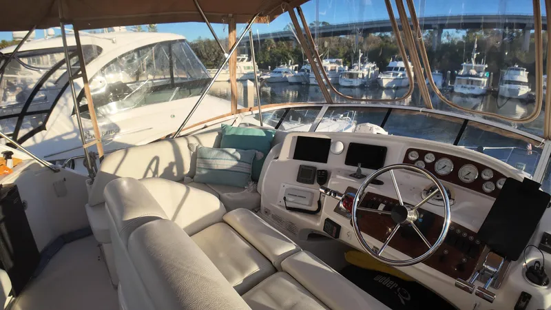  Yacht Photos Pics Interior view of 2002 Silverton 410 Sport Bridge yacht with helm and seating area.