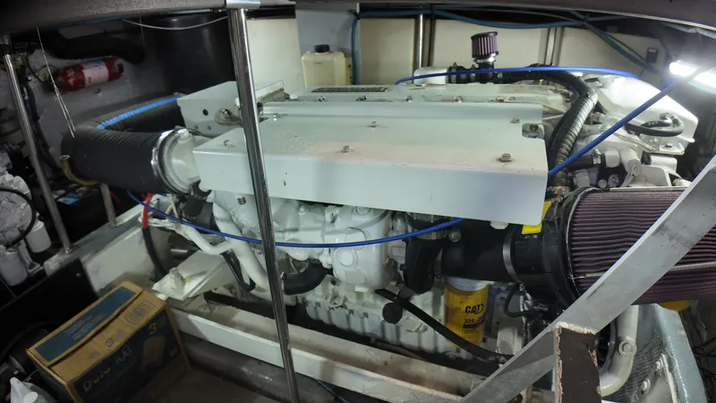  Yacht Photos Pics Engine room of 2002 Silverton 410 Sport Bridge yacht, showcasing detailed machinery.