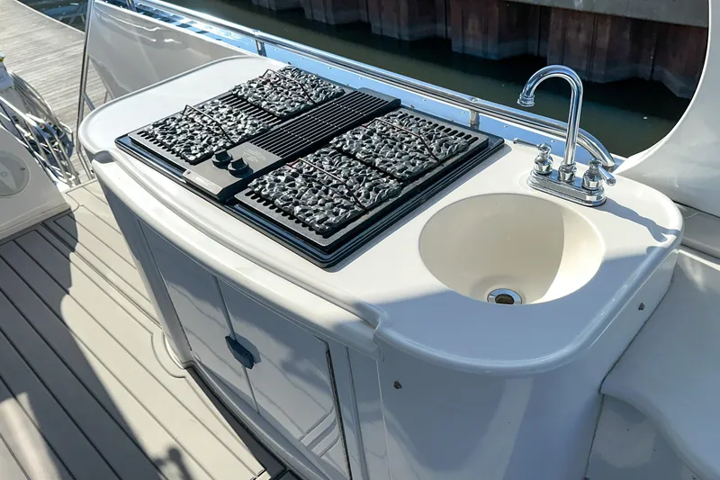  Yacht Photos Pics Outdoor kitchen on 2012 Bluewater 5200 Custom Series Yacht with grill and sink.