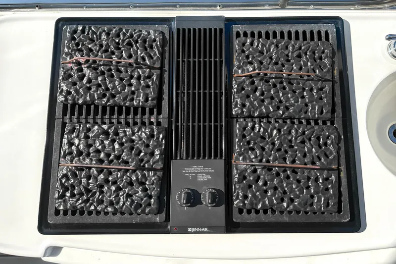  Yacht Photos Pics Outdoor grill on 2012 Bluewater 5200 Custom Series Yacht, featuring a Jenn-Air cooktop.