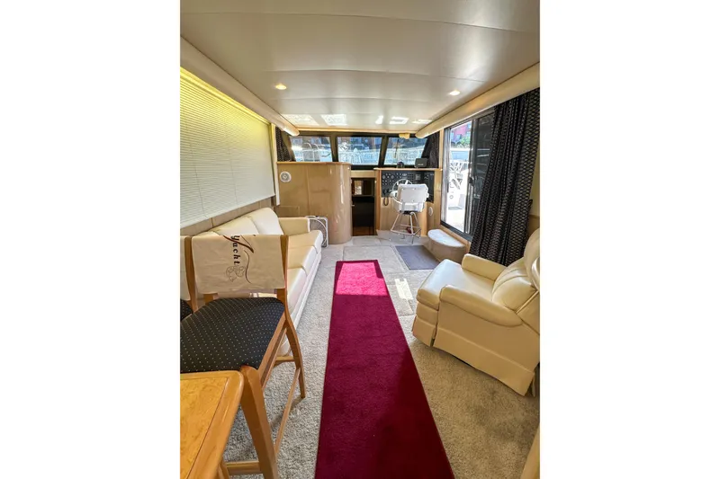  Yacht Photos Pics Luxurious interior of 2012 Bluewater 5200 Custom Series Yacht with elegant seating and helm.