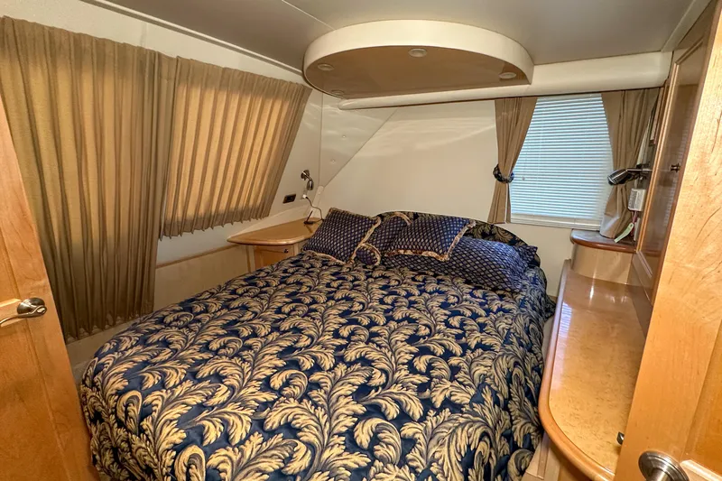  Yacht Photos Pics Luxurious bedroom interior of 2012 Bluewater 5200 Custom Series Yacht with elegant bedding.