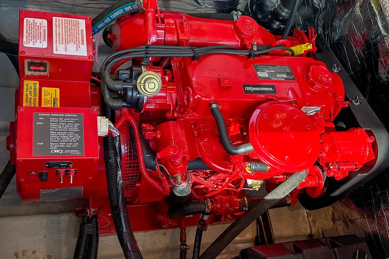  Yacht Photos Pics Red engine of a 2012 Bluewater 5200 Custom Series Yacht, detailed view.