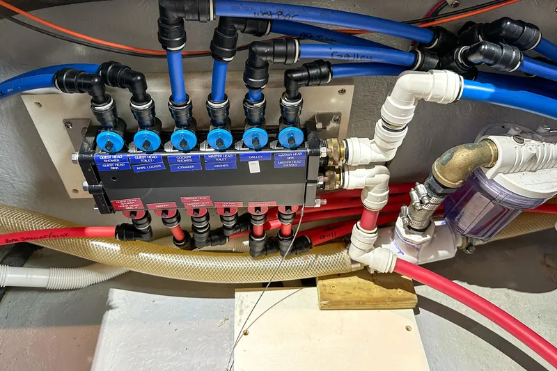  Yacht Photos Pics Plumbing system of 2012 Bluewater 5200 Custom Series Yacht with labeled valves and pipes.