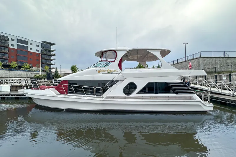  Yacht Photos Pics Luxury 2012 Bluewater 5200 yacht docked in urban marina setting.