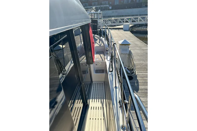  Yacht Photos Pics 2012 Bluewater 5200 yacht docked at marina, showcasing sleek deck design.