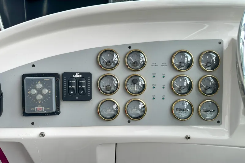  Yacht Photos Pics Control panel of a 2012 Bluewater 5200 boat with gauges and switches.