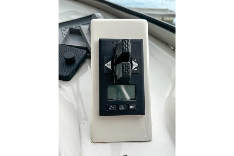  Yacht Photos Pics Control panel of a 2012 Bluewater 5200 boat with digital display and switches.