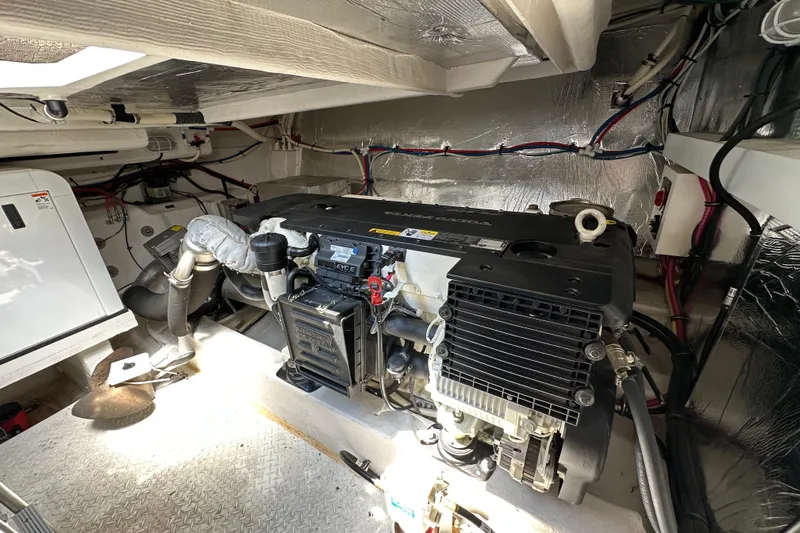 Sexy B'yacht-ch Yacht Photos Pics Engine room of 2013 Cruisers Yachts 45 Cantius, showcasing mechanical components and wiring.