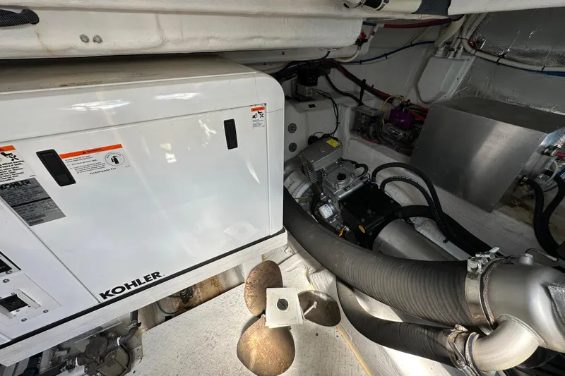 Sexy B'yacht-ch Yacht Photos Pics Engine room of 2013 Cruisers Yachts 45 Cantius with Kohler generator and mechanical components.