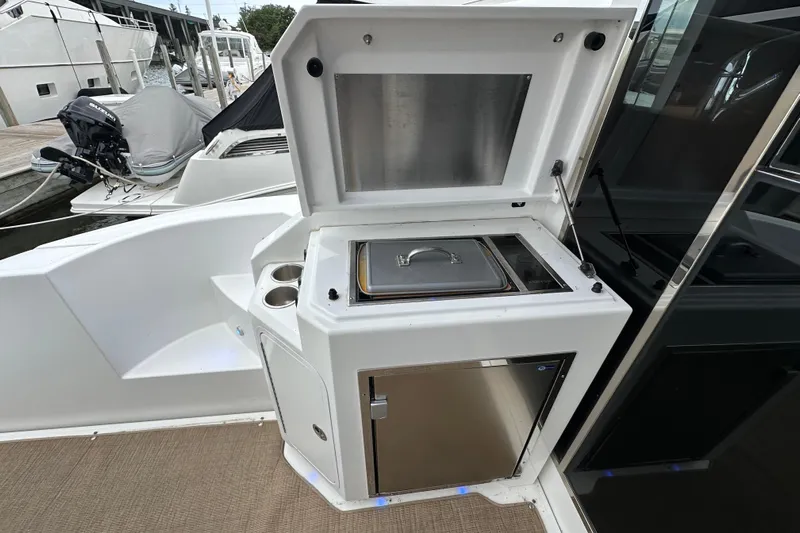Sexy B'yacht-ch Yacht Photos Pics Outdoor kitchen on 2013 Cruisers Yachts 45 Cantius, featuring grill and storage.