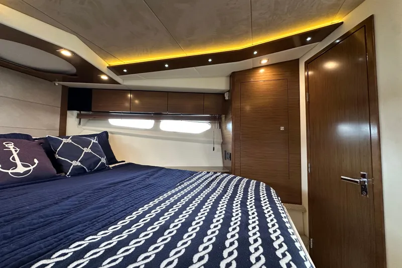 Sexy B'yacht-ch Yacht Photos Pics Luxurious bedroom interior of 2013 Cruisers Yachts 45 Cantius with nautical-themed decor.