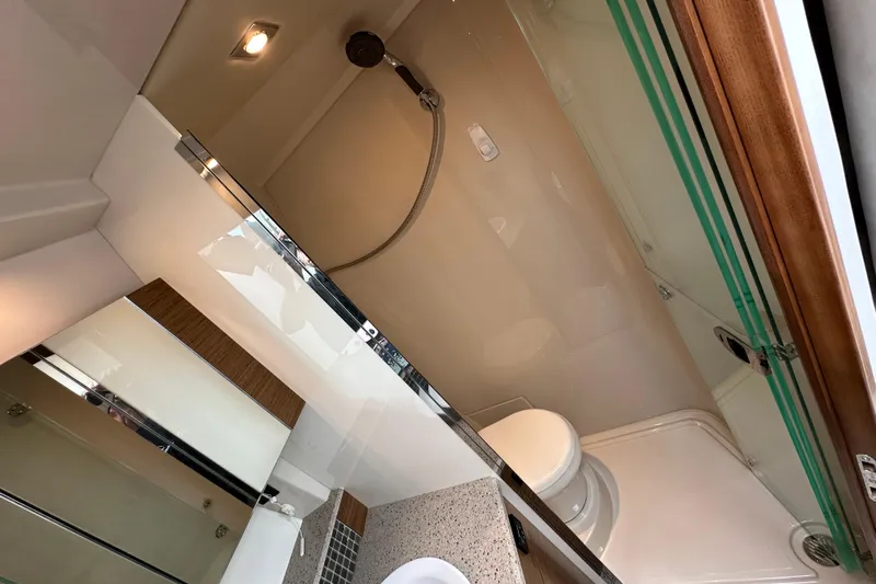 Sexy B'yacht-ch Yacht Photos Pics Bathroom interior of 2013 Cruisers Yachts 45 Cantius with shower and toilet.