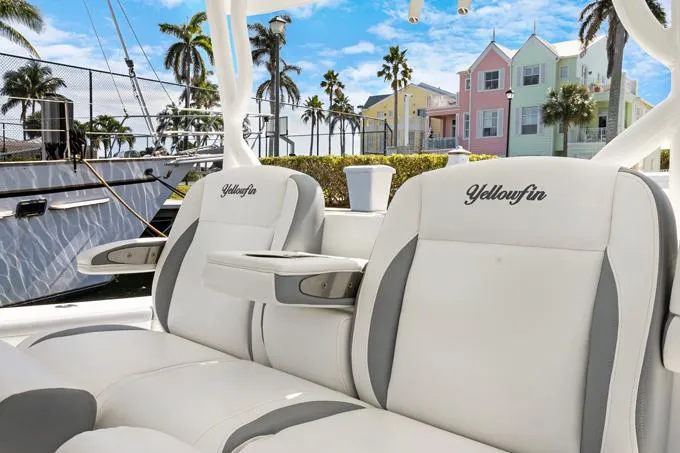 Seas The Day Yacht Photos Pics 2020 Yellowfin 39 Center Console boat seats with coastal backdrop.