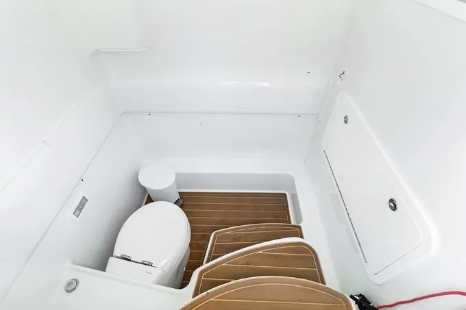 Seas The Day Yacht Photos Pics 2020 Yellowfin 39 Center Console boat interior with toilet and wooden flooring.
