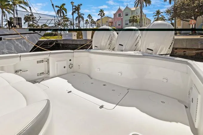 Seas The Day Yacht Photos Pics 2020 Yellowfin 39 Center Console boat with triple engines docked in a tropical marina.