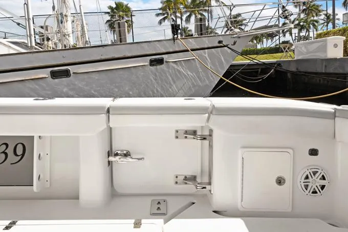 Seas The Day Yacht Photos Pics 2020 Yellowfin 39 Center Console boat docked, showcasing sleek white interior details.