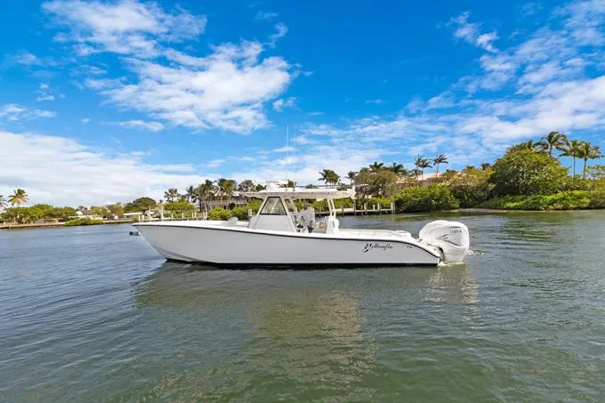Seas The Day Yacht Photos Pics 2020 Yellowfin 39 Center Console boat on a scenic waterway.