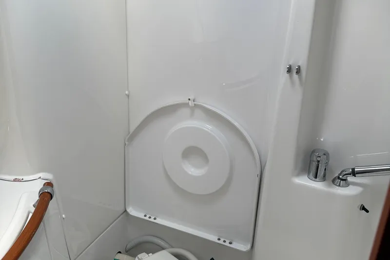 Aeolus Yacht Photos Pics Interior of 2007 Beneteau 423 yacht bathroom with shower and faucet.