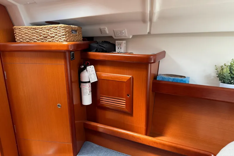 Aeolus Yacht Photos Pics Interior of 2007 Beneteau 423 yacht with wooden cabinetry and safety equipment.