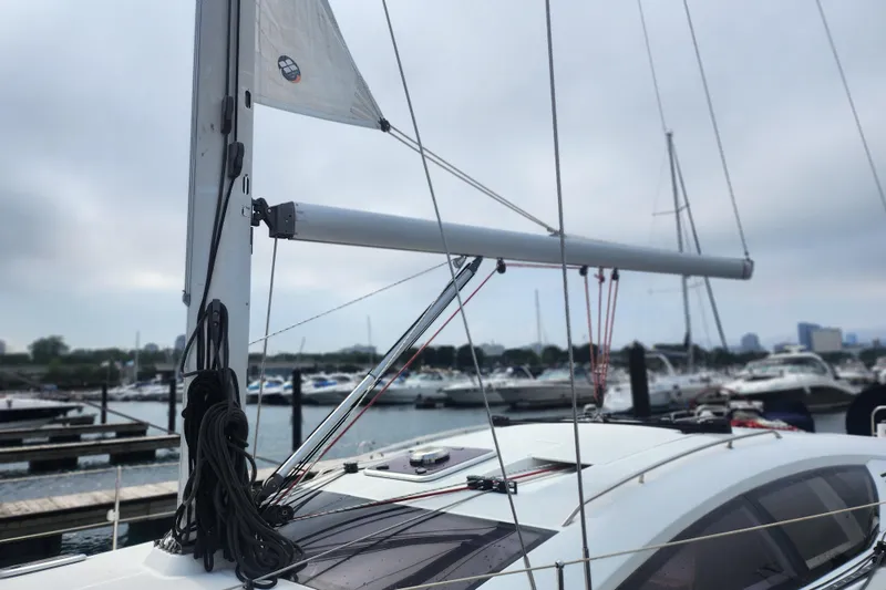 Vilia Yacht Photos Pics 2010 Jeanneau Sun Odyssey 45 DS sailboat docked at marina, mast and rigging visible.