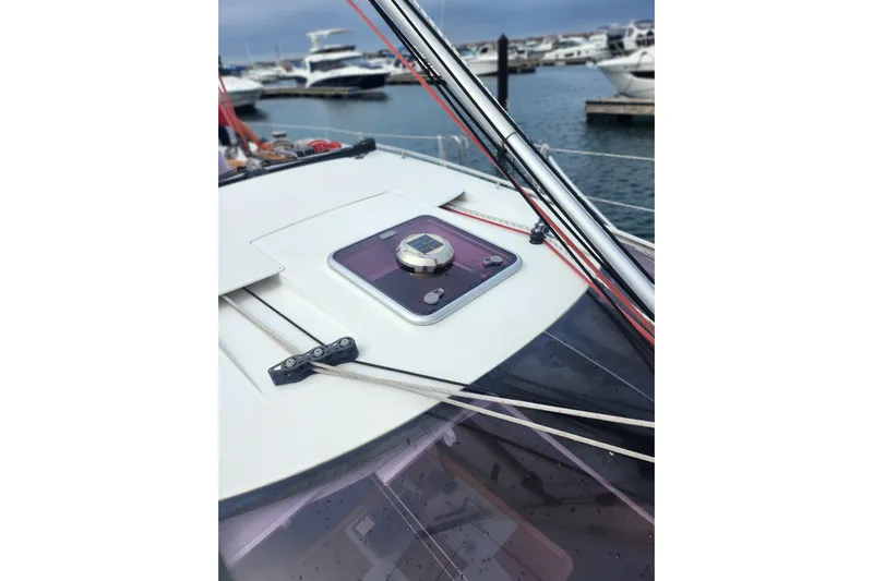 Vilia Yacht Photos Pics 2010 Jeanneau Sun Odyssey 45 DS yacht deck with marina background.