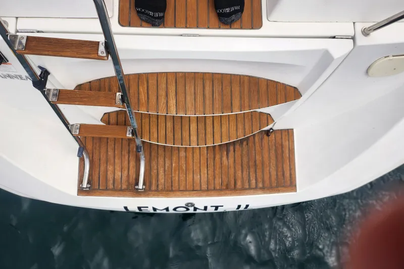 Vilia Yacht Photos Pics Teak swim platform and ladder on 2010 Jeanneau Sun Odyssey 45 DS yacht.
