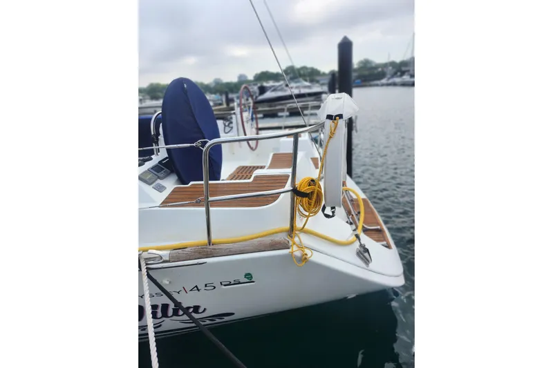 Vilia Yacht Photos Pics 2010 Jeanneau Sun Odyssey 45 DS sailboat docked, featuring deck details and mooring lines.