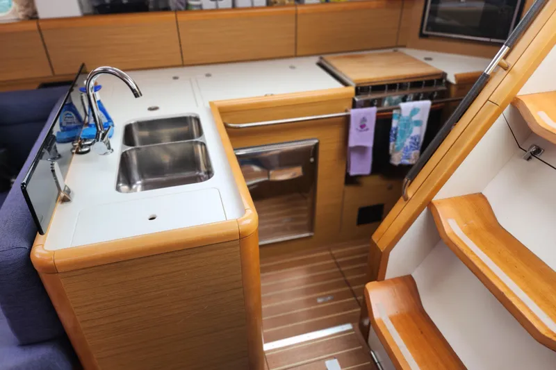 Vilia Yacht Photos Pics Interior of 2010 Jeanneau Sun Odyssey 45 DS yacht, featuring a modern kitchen area.