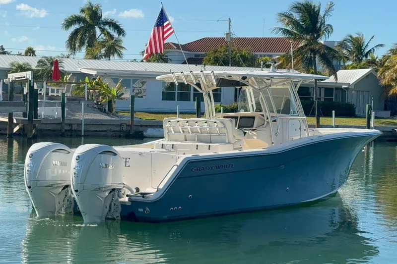 Repowered Yacht Photos Pics 2011 Grady-White Canyon 336 boat docked, featuring twin Yamaha engines, palm trees in background.