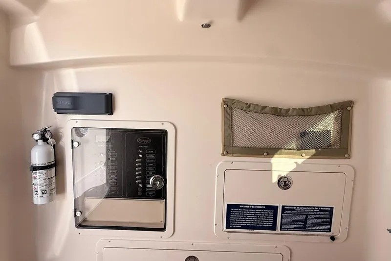 Repowered Yacht Photos Pics Control panel and safety equipment on 2011 Grady-White Canyon 336 boat interior.