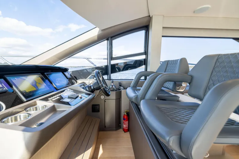 In The Moment Yacht Photos Pics Luxurious 2018 Sunseeker Manhattan 52 yacht interior with modern helm and seating.