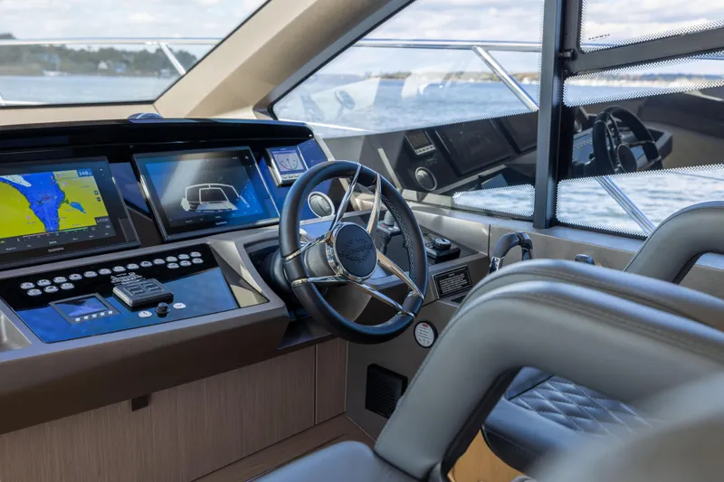 In The Moment Yacht Photos Pics Helm of 2018 Sunseeker Manhattan 52 yacht with modern navigation displays.