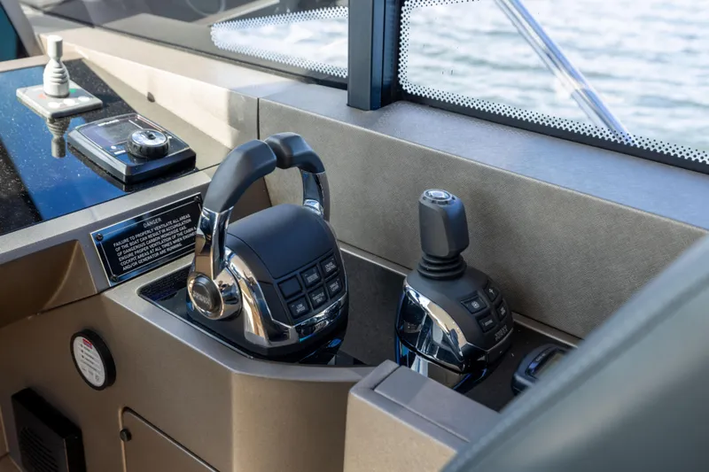 In The Moment Yacht Photos Pics Control panel of a 2018 Sunseeker Manhattan 52 yacht, featuring modern navigation equipment.