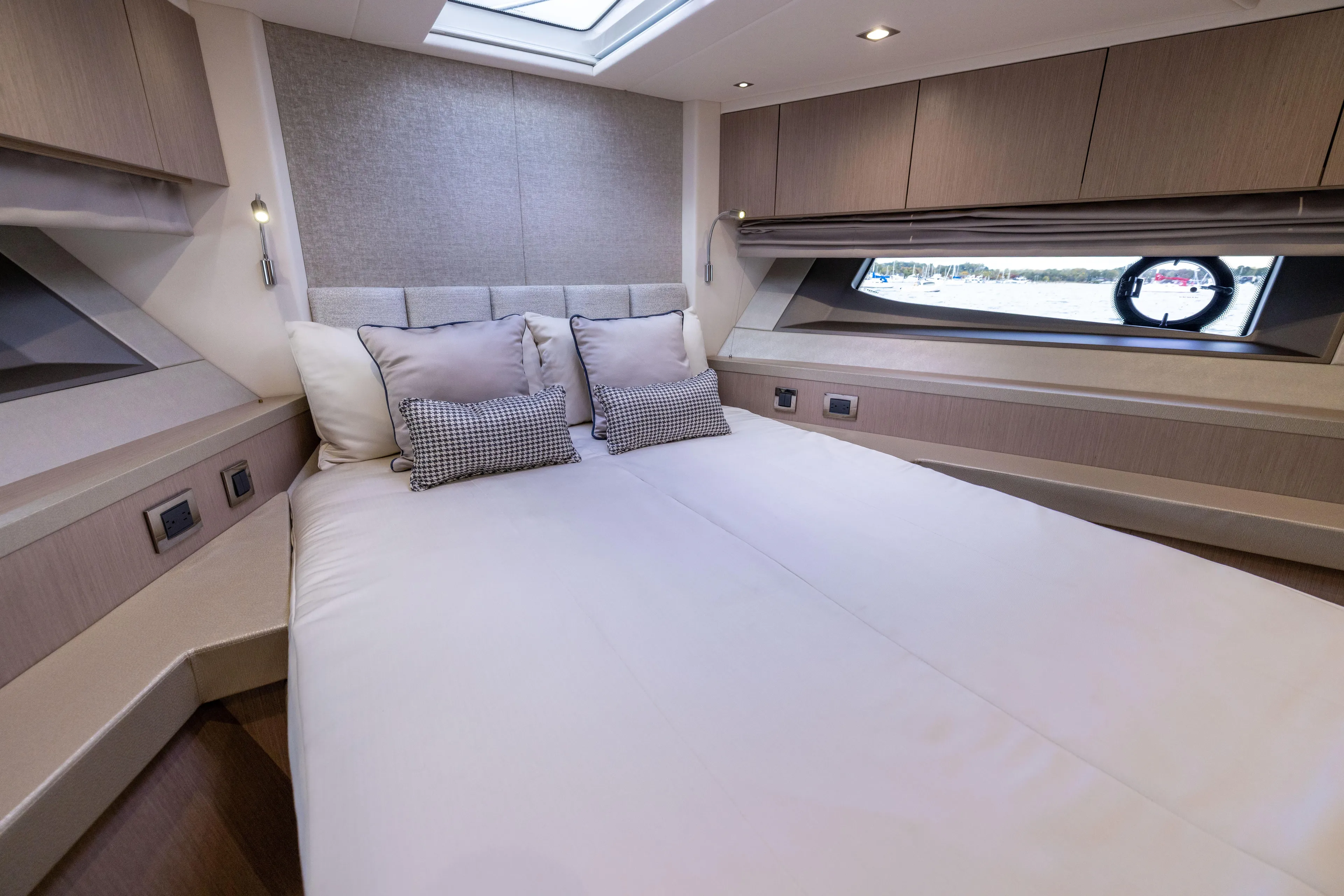 In The Moment Yacht Photos Pics Luxurious bedroom interior of 2018 Sunseeker Manhattan 52 yacht with elegant bedding.