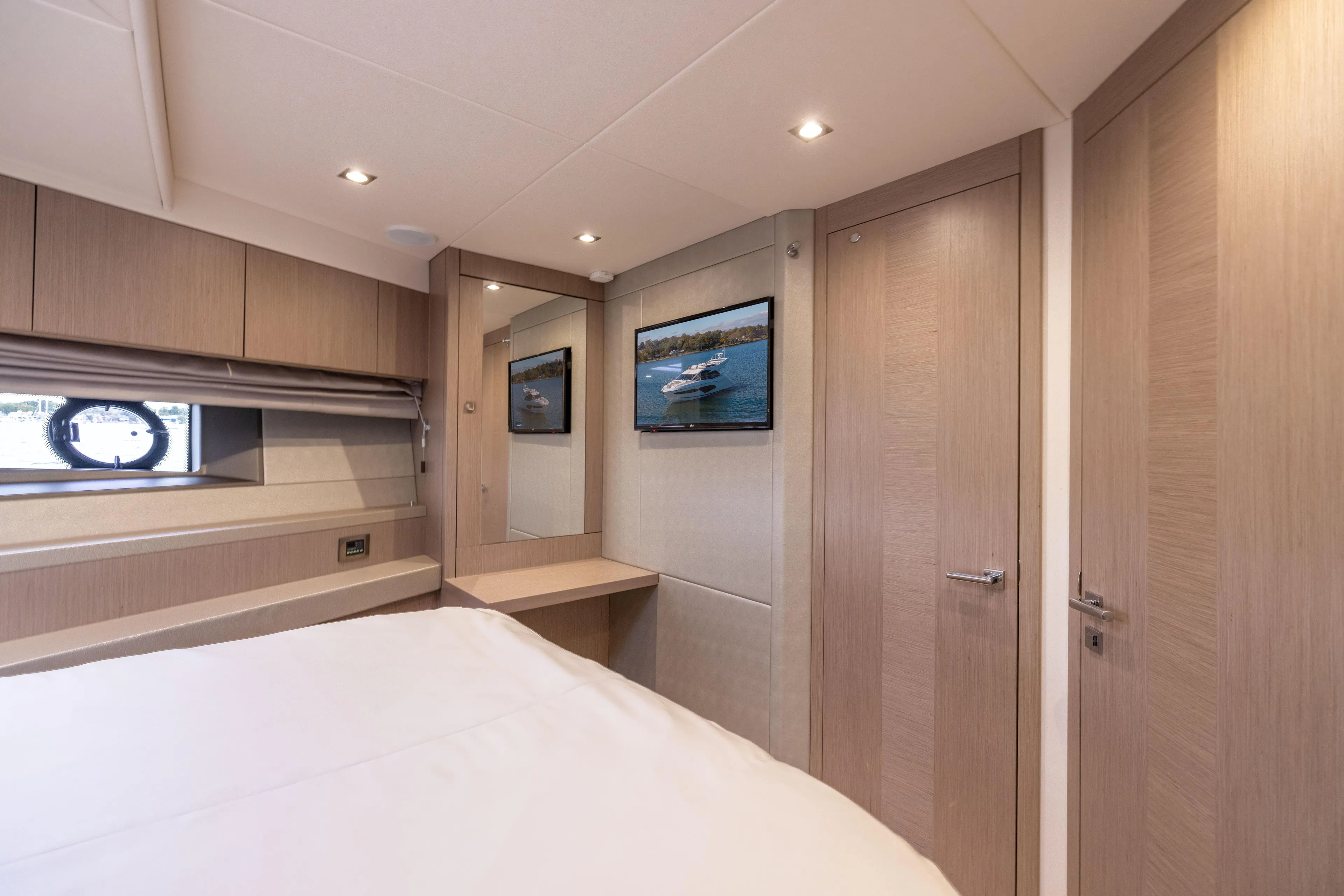 In The Moment Yacht Photos Pics Luxurious interior of 2018 Sunseeker Manhattan 52 yacht cabin with modern decor.