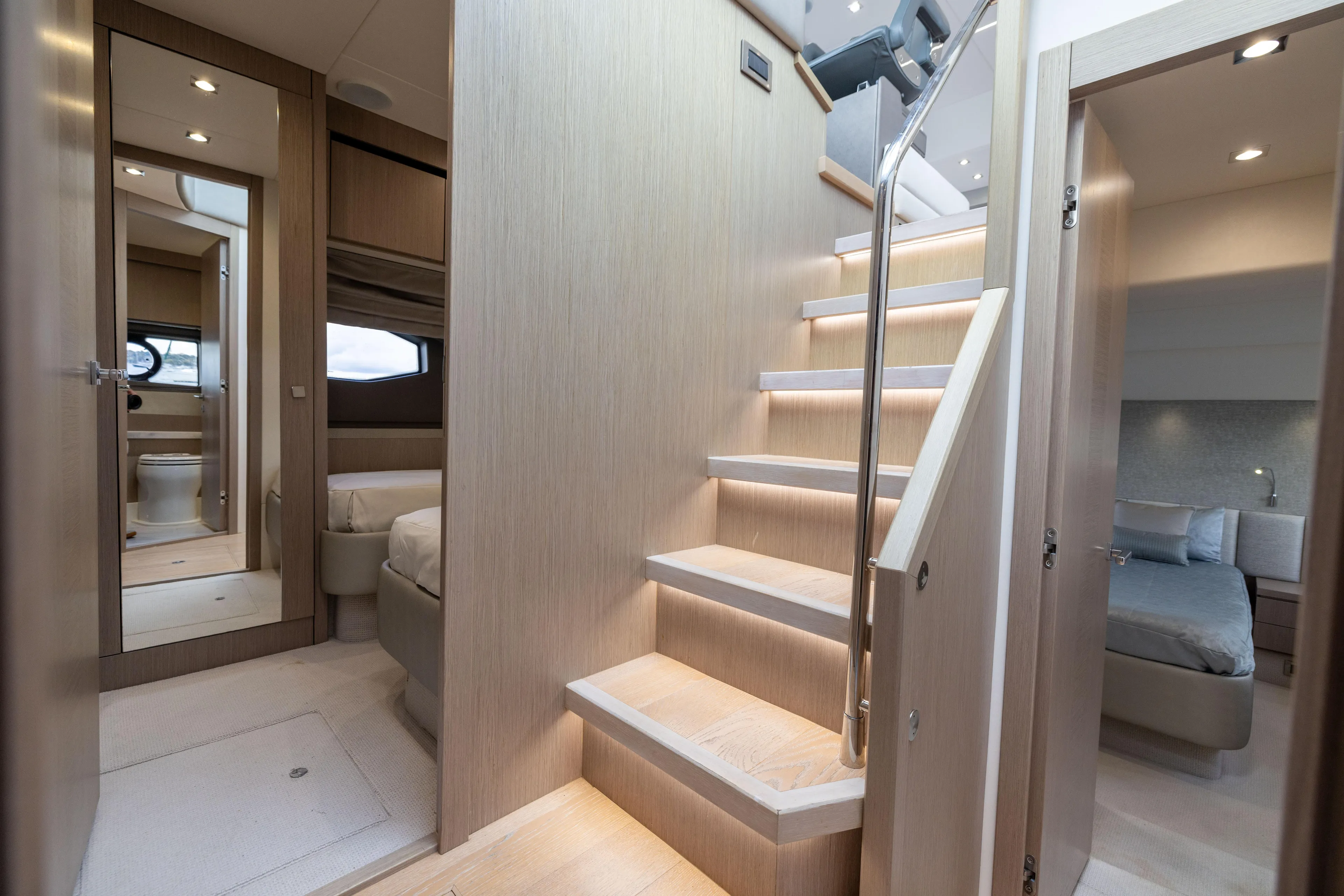 In The Moment Yacht Photos Pics Luxurious interior of 2018 Sunseeker Manhattan 52 yacht with modern staircase and bedrooms.