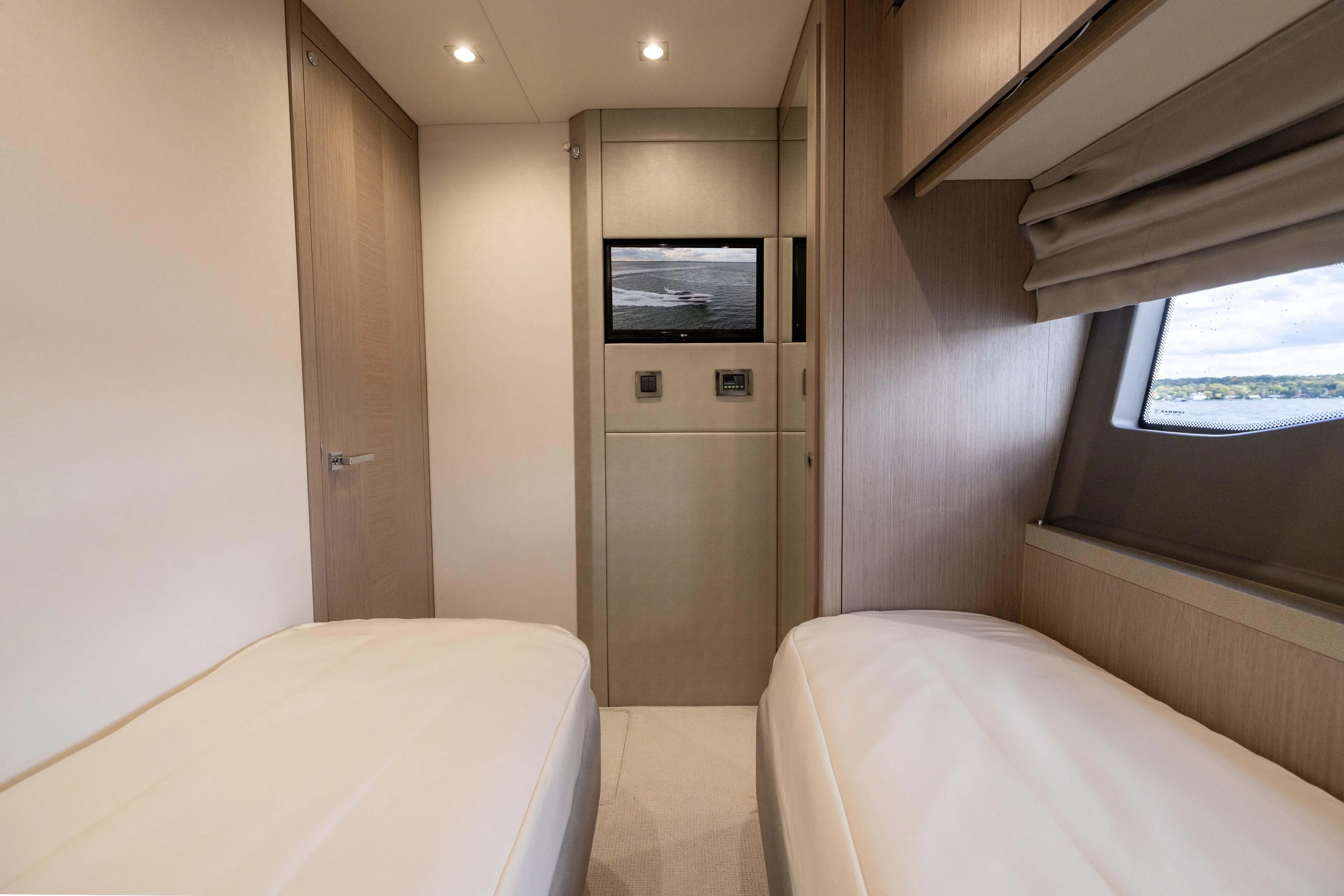 In The Moment Yacht Photos Pics Luxurious cabin interior of 2018 Sunseeker Manhattan 52 yacht with twin beds.