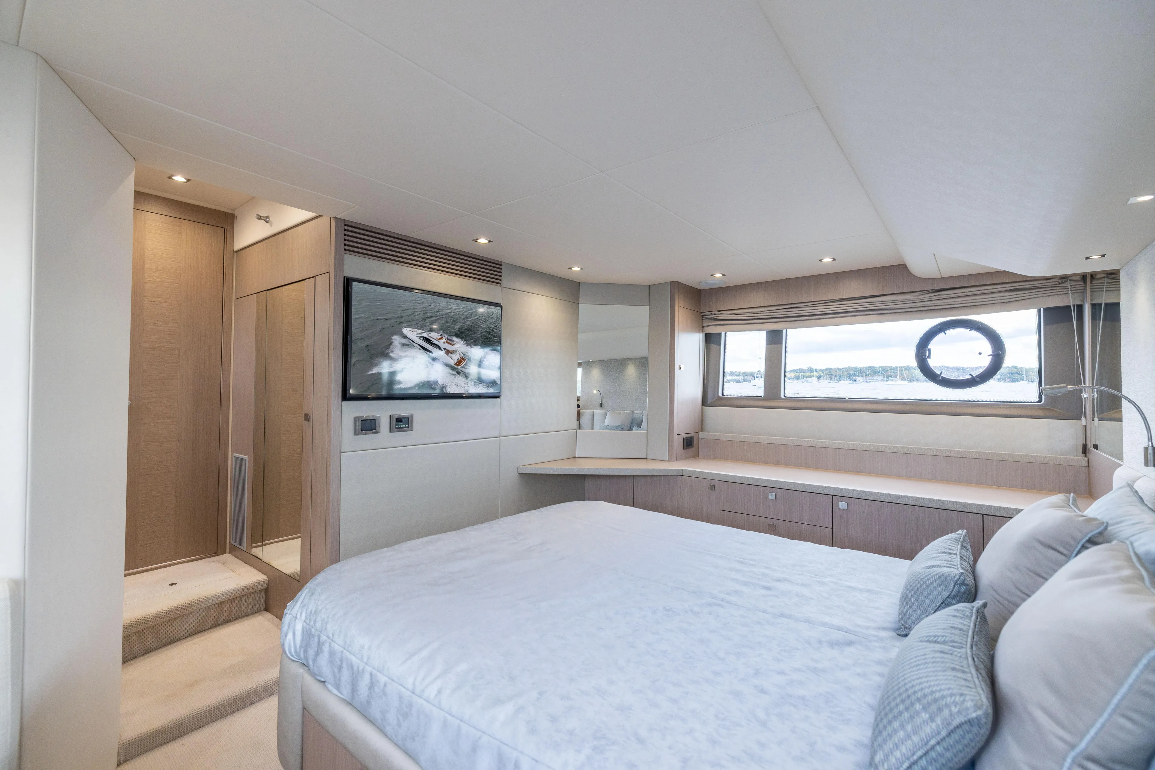 In The Moment Yacht Photos Pics Luxurious bedroom interior of 2018 Sunseeker Manhattan 52 yacht with modern amenities.