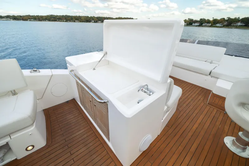 In The Moment Yacht Photos Pics Luxurious 2018 Sunseeker Manhattan 52 yacht deck with open storage and seating.