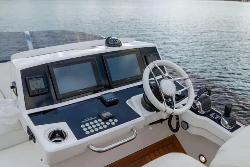 In The Moment Yacht Photos Pics Cockpit of 2018 Sunseeker Manhattan 52 yacht with modern navigation controls.