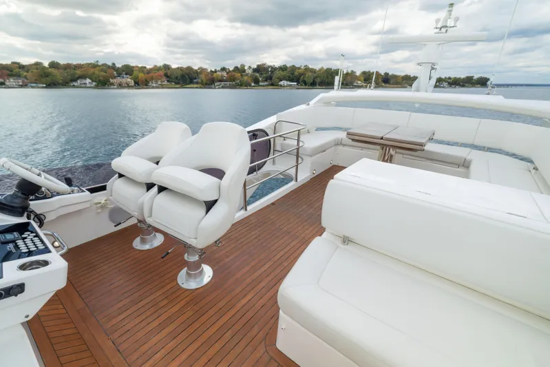 In The Moment Yacht Photos Pics Luxurious 2018 Sunseeker Manhattan 52 yacht with spacious deck and seating area.