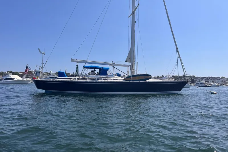  Yacht Photos Pics Sailing yacht Nautor Swan 61, 1990 model, anchored in a sunny harbor.
