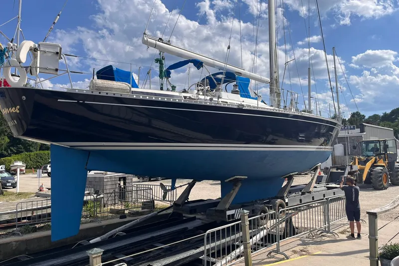  Yacht Photos Pics Nautor Swan 61 sailboat from 1990 on a trailer, ready for transport.