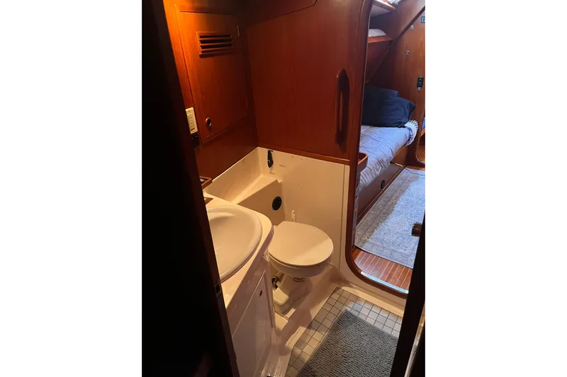  Yacht Photos Pics Interior of 1990 Nautor Swan 61 yacht showing bathroom and adjacent cabin.