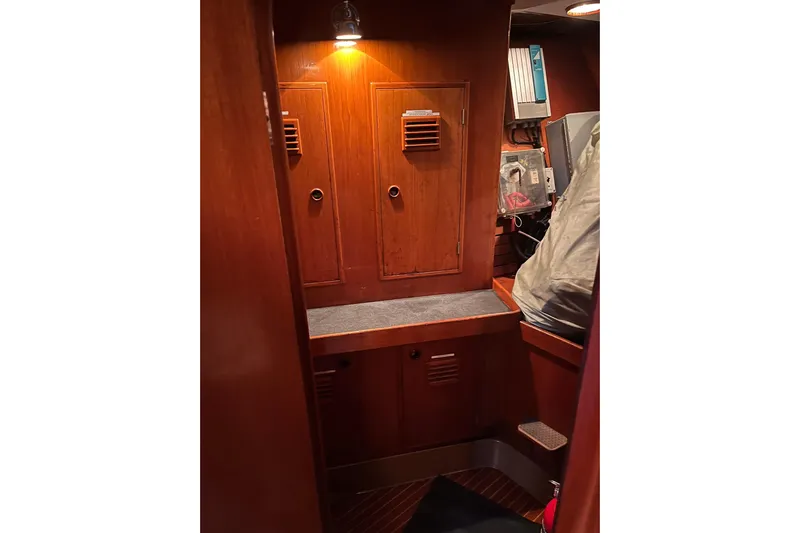 Yacht Photos Pics Interior of 1990 Nautor Swan 61 yacht with wooden cabinetry and ambient lighting.