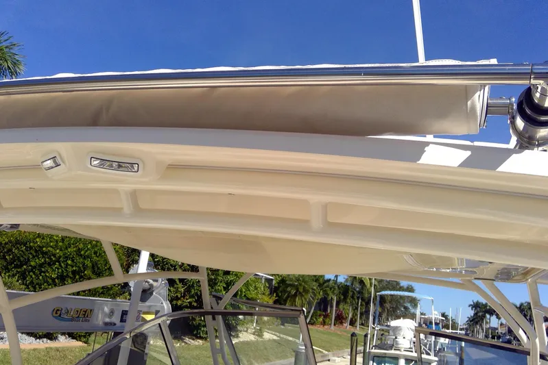  Yacht Photos Pics 2023 Grady-White Freedom 285 boat canopy and structure, with clear blue sky background.